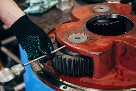 Worker assembling the planetary gearの写真素材