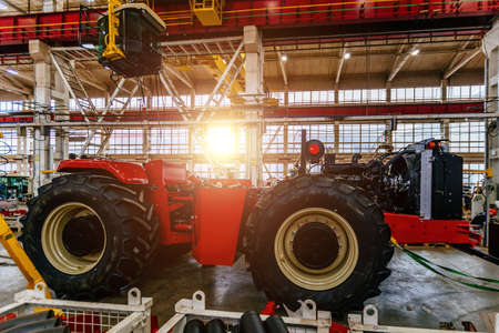 Assembly process of agricultural tractors in industrial workshop.の写真素材