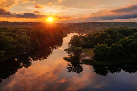 Sunset above the river in natural rural landscape.の写真素材