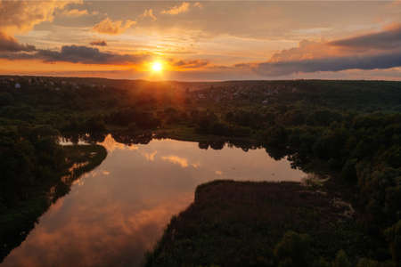 Sunset above the river in natural rural landscape.の写真素材
