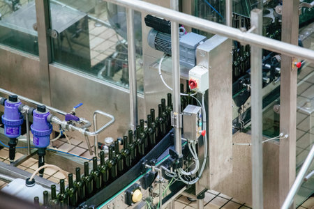 Bottling and sealing wine conveyor production line at modern wineryの写真素材