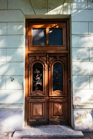 Vintage wooden brown door of old mansion