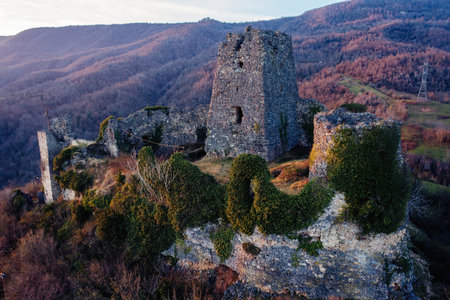 ancient fortress. Shkhepi Castle ruin in mountains at the sunset, aerial drone view.の写真素材