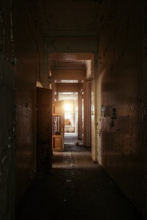 Dark and creepy corridor of old abandoned mental hospital.の写真素材