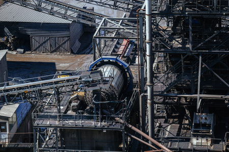 Big ball mill grinds ore in ore dressing treatment plant.