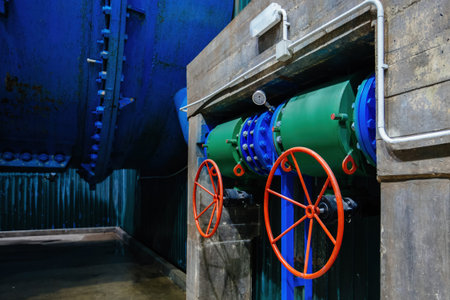 Plumbing pipe with two valves and pressure gauge. Water pressure regulation in hydroelectric power...