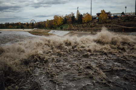 Spillway in Maykop dam, dirty water in river.の写真素材