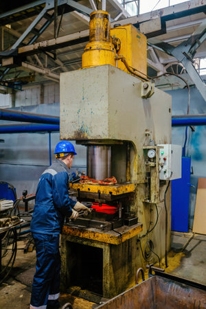 Process of pressing and quenching of hot iron part.の写真素材