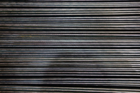 Group of threaded steel rods, abstract background.の写真素材