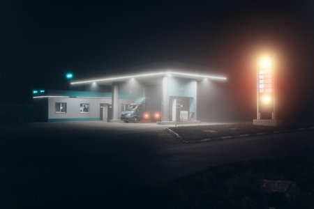 Gas station at foggy night.の写真素材