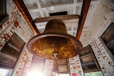 Old rusty bell in bell tower in Lutheran church Lumivaara.