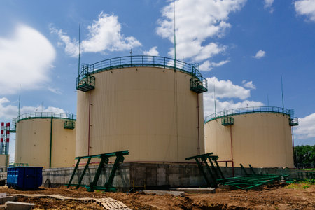 Large industrial round tanks for chemical production or oil. Construction of chemical factory.