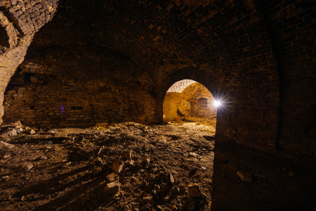 Dark and creepy vaulted red brick dungeon.の写真素材