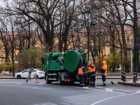 Sewer workers cleaning manhole and unblocking sewers.の写真素材