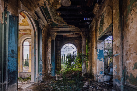 Ruined abandoned building overgrown by plants and moss.の写真素材