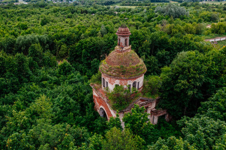 Old overgrown ruined abandoned church, aerial view. Church of the Icon of the Mother of God The Sign, Drezgalovo, Lipetsk region.の写真素材