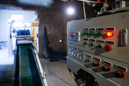Control panel of CNC machine in industrial workshop.