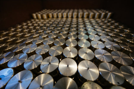 Cylindrical spare parts in rows, close up.の写真素材