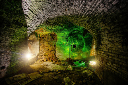 Dark and creepy vaulted brick cellar under old castle.の写真素材