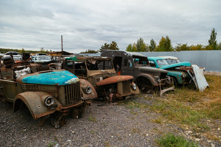 Old rusty cars in junkyard.の写真素材