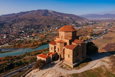 Drone aerial view of Jvari monastery and the mountains in Mtskheta, Georgia.