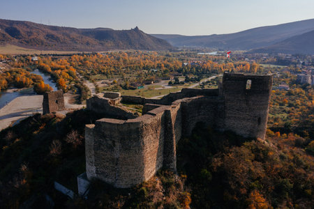 Ancient old fortress. Bebristsikhe castle ruin in mountains, aerial drone view.