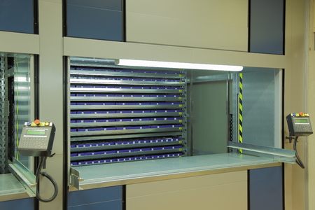 Automated storage system in the warehouse.Vertical carousel storage unitの写真素材