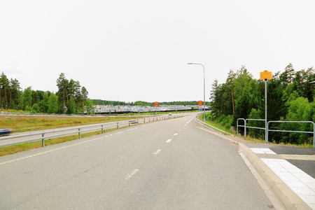View over the highway with modern cottage settlement on the left sideの写真素材
