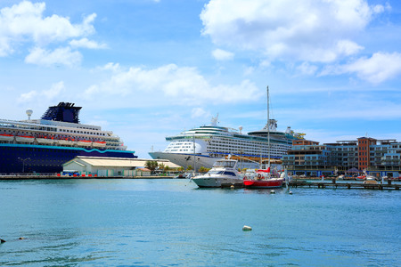 view on a pier with several large boatsの写真素材