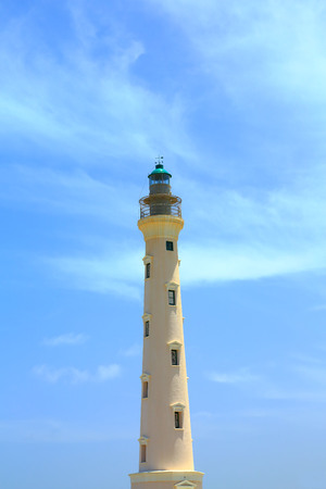 California Lighthouse on blue sky background isolated, Aruba coastline. Nice background.の写真素材