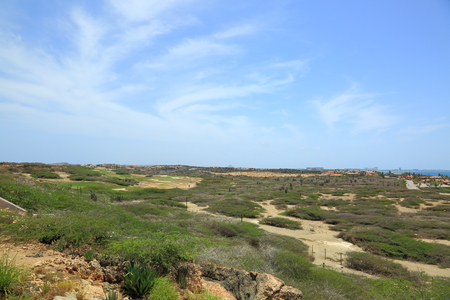Natural beauty of Aruba. North coast. Off-road Aruba. Amazing stone desert landscape, blue sea and blue sky. September, 2017の写真素材