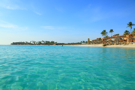 Amazing beauty white sand beach of Aruba Island. Turquoise sea water and blue sky. Beautiful background.の写真素材