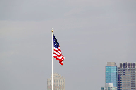 American flag on sky background.
