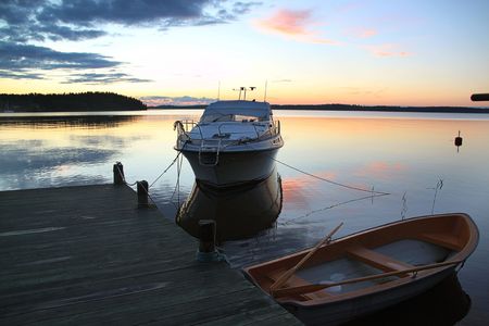 Amazing beauty colorful sunset on the lake in Sweden. Unforgettable view. Amazing background.の写真素材