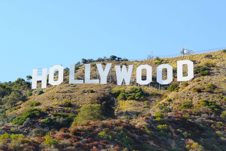 HOLLYWOOD sign on blue sky background. World famous landmark. Los Angeles, California. 09-11-2012.のeditorial素材