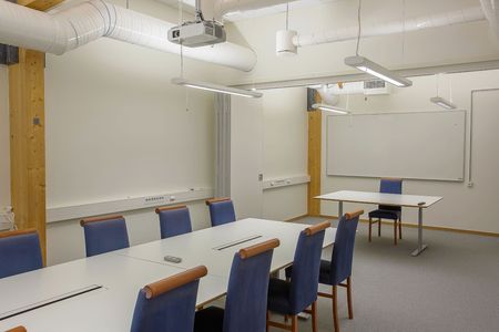 Modern conference / meeting room isolated. White office table and blue chairs. Business concept. Modern office style. Swedenの写真素材