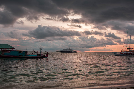 Gorgeous view of sunset on Indian Ocean, Maldives. Some boats on horizon line. Amazing nature landscape background.の写真素材