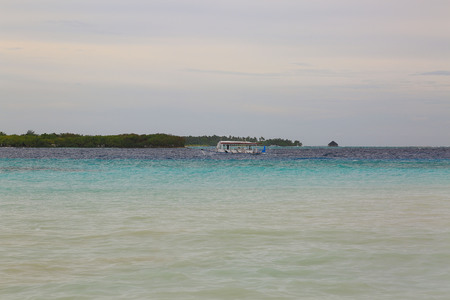 Gorgeous view of colorful Indian Ocean, Maldives. Small transport.の写真素材