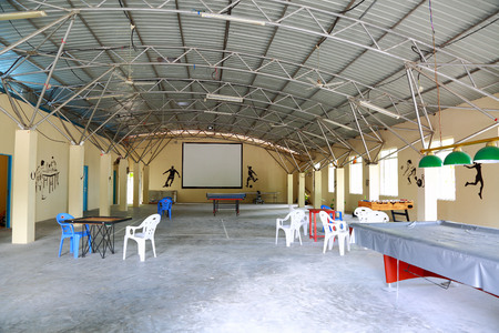 View of the empty sport room in the big hangar with table football, place for board games, table tennis. Free time concept.のeditorial素材