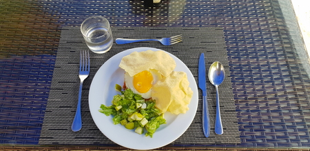 Served table isolated on the coast. Beautiful white sand on background. Indian ocean. Maldives.の写真素材