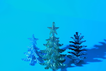 Closeup view of christmas decoration isolated in blue. Silver and gold christmas tree. Beautiful christmas backgrounds.の写真素材
