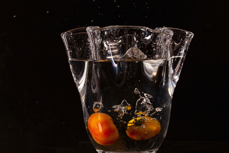 Close up view of water and yellow fruits. Beautiful backgrounds.の写真素材