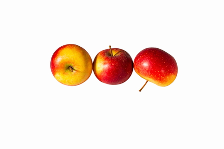 Red apples close up view isolated on white background with clipping path. Beautiful background.の写真素材
