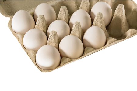 Close up view of white chicken eggs in an egg cell isolated. Food backgrounds. Healthy eating concept.の写真素材