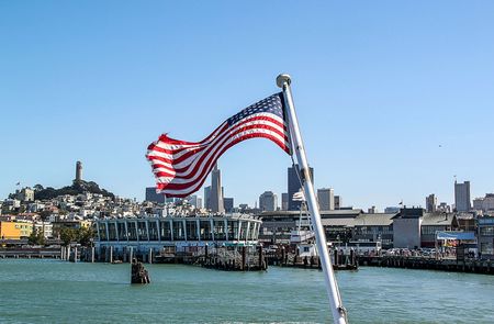 Beautiful view of San Francisco with flag on front line. Beautiful backgrounds.の写真素材