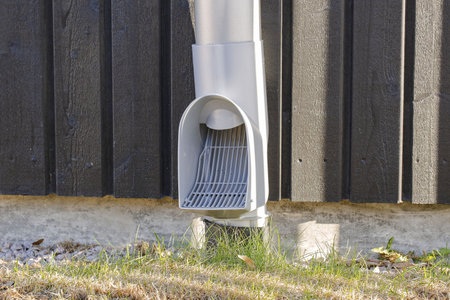 Close up view of modern drain pipe with grid. Modern technology concept.