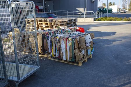 Take care of garbage storage. Pressed papper packagings and cartongs ready to be transported to recycling station. Enviroment concept.の写真素材