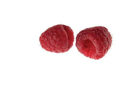 Close up macro view of a beautiful raspberry berry isolated on white background.