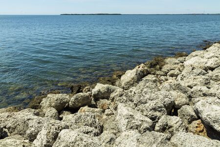 Beautiful view of rocky coast on blue water of Atlantic ocean background.の写真素材