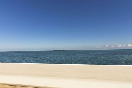 Beautiful view on Atlantic ocean blue water merging with light blue sky.の写真素材